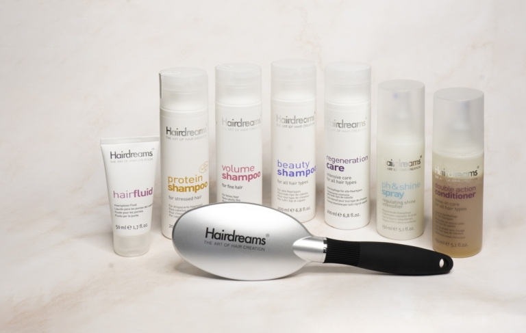Photo of the hair care product line and the extension brush from Hairdreams