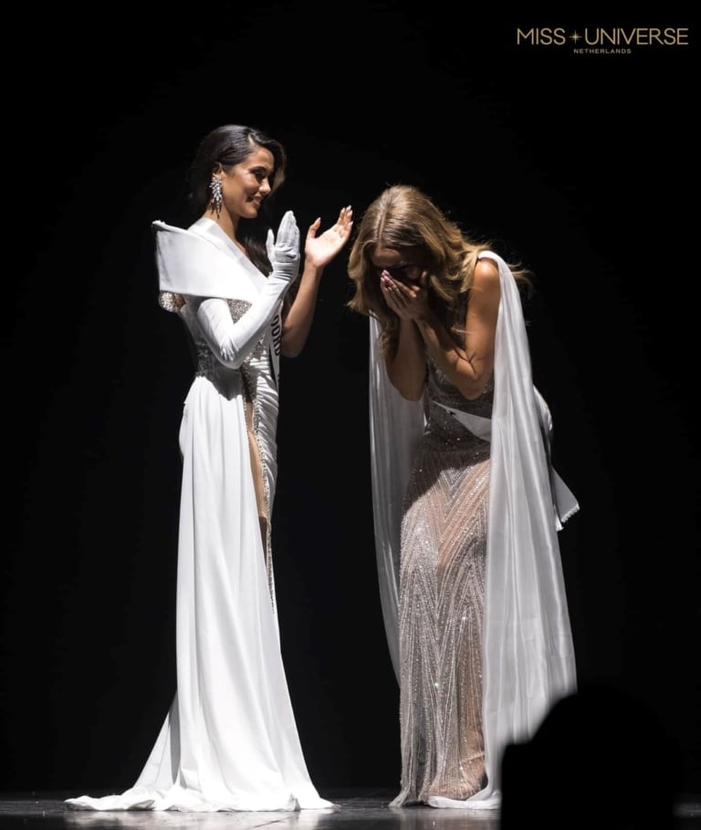 A woman is crowned the new Miss on stage.