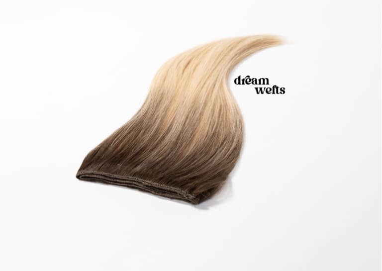 Photo of a Hairdreams real hair weave with balayage gradient and the lettering "dreamwefts"