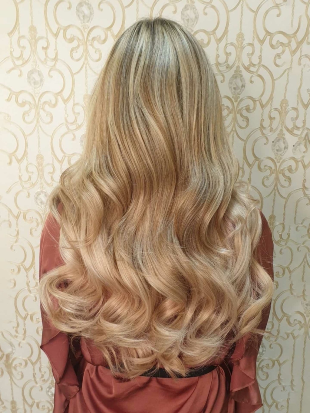 After picture of a hair extension with Quikkies Tape Extensions on a woman with blond long hair