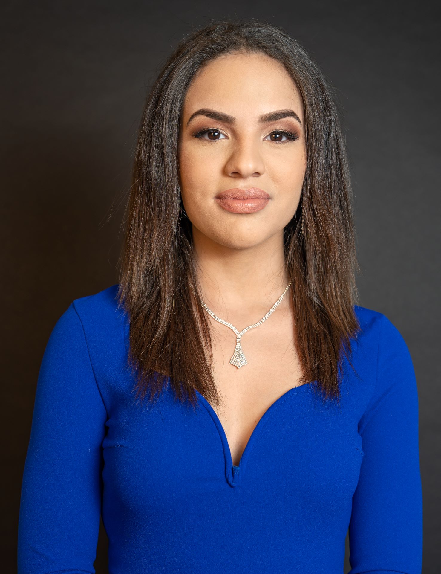 Woman with shoulder-length dark brown hair